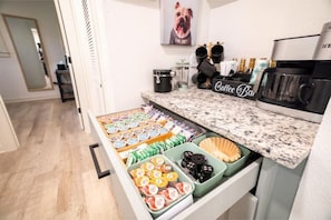 Fully stocked coffee bar with Dual Keurig machine, tea and hot chocolate
