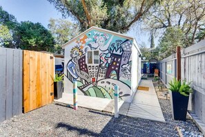 A joyful welcome to a tiny home in a fun city. 