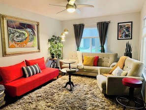 A cozy living room complete with original art from local artists