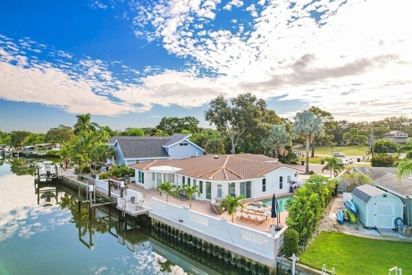 Welcome to your waterfront oasis, where relaxation knows no bounds. Enjoy the poolside lounge, dip your feet in the jacuzzi, and let the mesmerizing bay views whisk you away