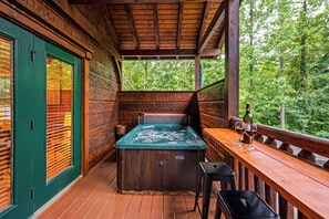 Glass or wine while enjoying the greenery or a dip in the hot tub?