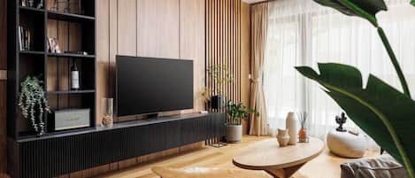Stylish living room with couch and an 120cm wide Smart TV 