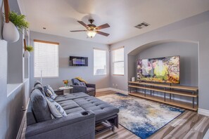 75" UHD TV, Sofa Bed and Chaise Lounge Chair coupled with electric LED fireplace