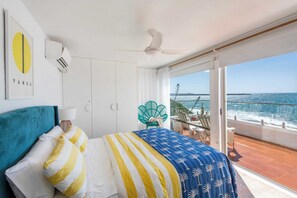 Absolute Oceanfront - Yamba Accommodation - Second bedroom with air-conditioning, queen bed, private balcony and absolute ocean views.
