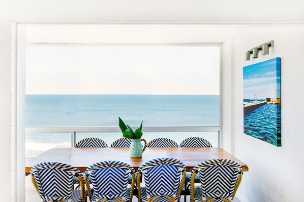 Absolute Oceanfront - Yamba Accommodation - Air-conditioned dining room ocean views.