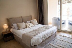 A cozy bed with a pristine white blanket, inviting you to relax and unwind