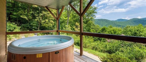 Indulge in some self-care and soak away your stress in our front porch hot tub.