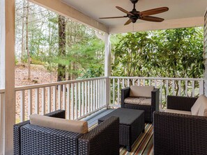 Enjoy the outdoors in this front porch seating area.