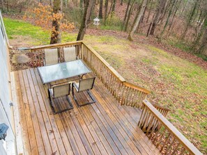 Step outside and embrace nature on the lower deck, your gateway to the backyard bliss.