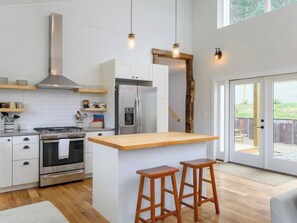 Whip up a meal in this cozy kitchen island.