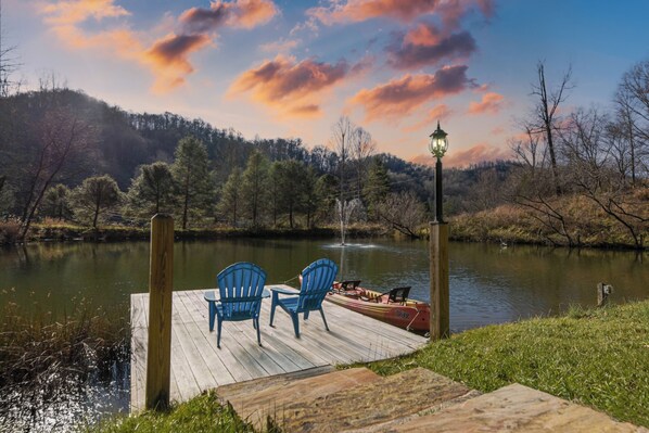 Take in the beauty of this large private pond a quaint deck.