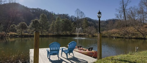 Take in the beauty of this large private pond a quaint deck.