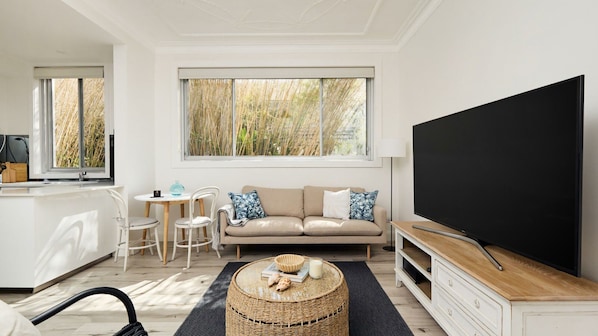 Discover our meticulously curated North Bondi retreat, blending warm tones and natural finishes for a coastal-inspired haven