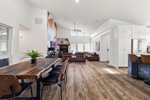 Upstairs floor, where the kitchen, dining, and living areas come together in a seamless display of modern elegance.