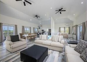 Great room with 15-foot ceilings and ocean views, a spacious living area with large comfortable sofas!