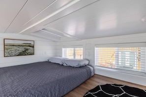 Enjoy a restful night on a comfortable queen-sized bed with soft, crisp linens. The plush mattress provides the perfect balance of support and comfort, ensuring you wake up feeling refreshed and ready to take on the day.