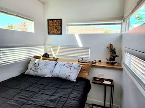 Enjoy a restful night on a comfortable queen-sized bed with soft, crisp linens. The plush mattress provides the perfect balance of support and comfort, ensuring you wake up feeling refreshed and ready to take on the day.