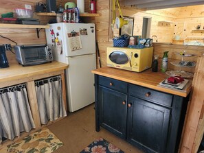 Microwave, refrigerator, and counter top oven/air fryer.