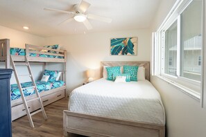 The guest room has twin bunk beds and a queen bed.