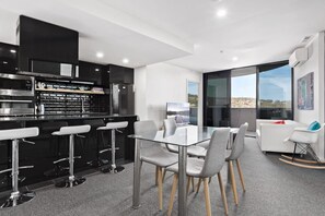 Experience the elegance of a black-and-white apartment, where contemporary design and classic color contrasts create a refined and timeless living space.