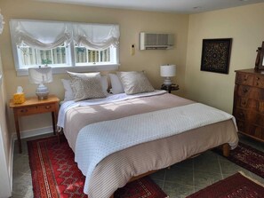 Ground floor bedroom with luxury linens and king size bed