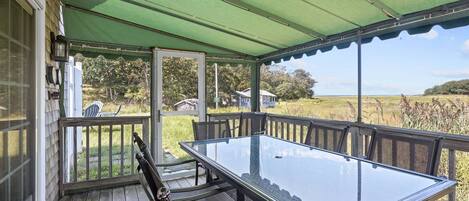 Gorgeous glades view from outdoor dining set and screened in back porch.  Note: this screened covered porch is only up in the Spring through early Fal