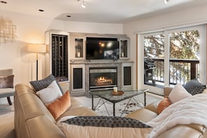 A cozy and inviting living room beckons you to relax and unwind after a long day of enjoying all that Aspen has to offer.