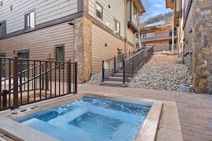 Enjoy a hot soak after a day of adventures in the new hot tub at the Dolomite Townhomes.