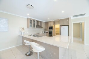 Kitchen + Coffee Machine + Breakfast Bar
