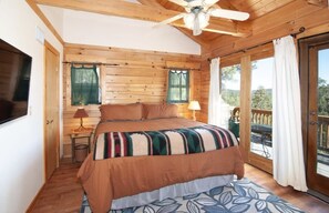 Primary bedroom with King size bed, ensuite bathroom, and ensuite deck.