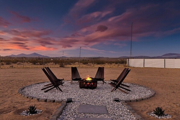 Fire pit and lounge chairs to hang out underneath the desert stars.
