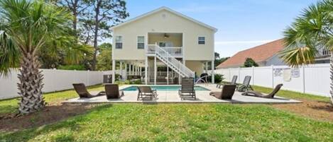 Welcome to Latitude Adjustment - a luxury beach house with a sparkling heated pool!