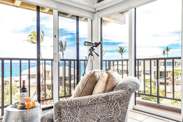The living room opens up to the outside for open-air living with indoor space.