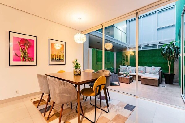 Open the floor-to-ceiling sliding glass doors to extend the living space