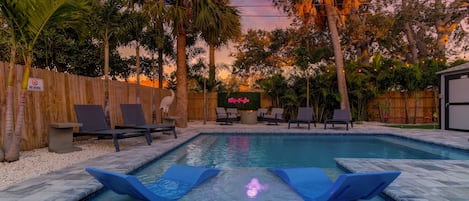 Heated pool with sun shelf