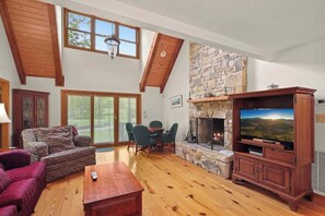 Experience warmth and comfort in our first-floor living room, complete with a cozy fireplace—a perfect space for relaxation and shared moments