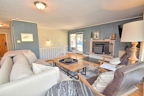 Family room towards back patio and downstairs