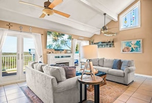 Cozy coastal charm meets stunning beach views—step right out from the living room balcony and soak it all in.

