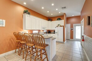 Kitchen with additional seating along the bar