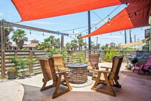 Gather around the fire pit under the sun and enjoy coastal breezes and good company.
