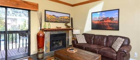 Relax in the main living area, with wood fireplace and comfy couches.  