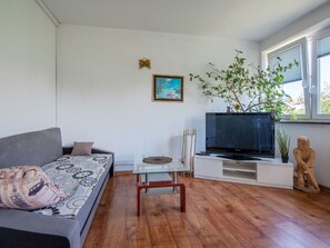 Furniture, Plant, Property, Comfort, Wood, Houseplant, Window, Interior Design, Flooring, Living Room