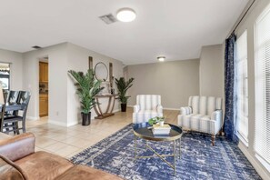 A sitting area is located at the front of the home, just inside the front door.