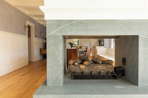 Beautiful fireplace is open to the dining room and living area!