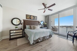 This thoughtfully designed bedroom maximizes natural light and integrates seamlessly with the surrounding environment. The expansive sliding doors and serene color palette create a harmonious and inviting space.