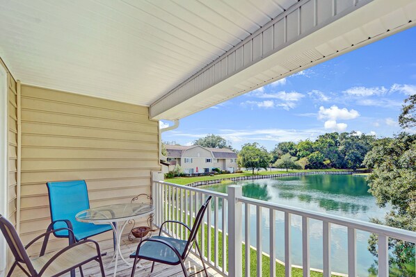 Second-Floor Patio with Lake Views - From your private second-floor balcony, soak up panoramic lake views, afternoon breezes, and quiet moments that make this St. Simons vacation rental feel like home.