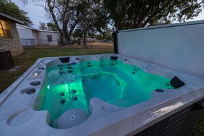 Soak in the large hot tub to unwind after a fun filled day.