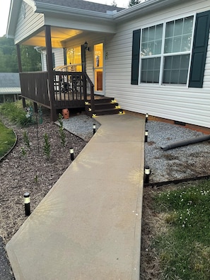 Walkway to front porch. Solar LED lights will illuminate at dusk. 