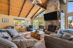 Living room with flat-screen tv and fireplace.