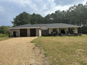 Front of main house and studio to the left of the garage